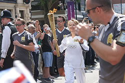 The Olympic Torch borne by Danuta Ryland passing through Finchley, London.